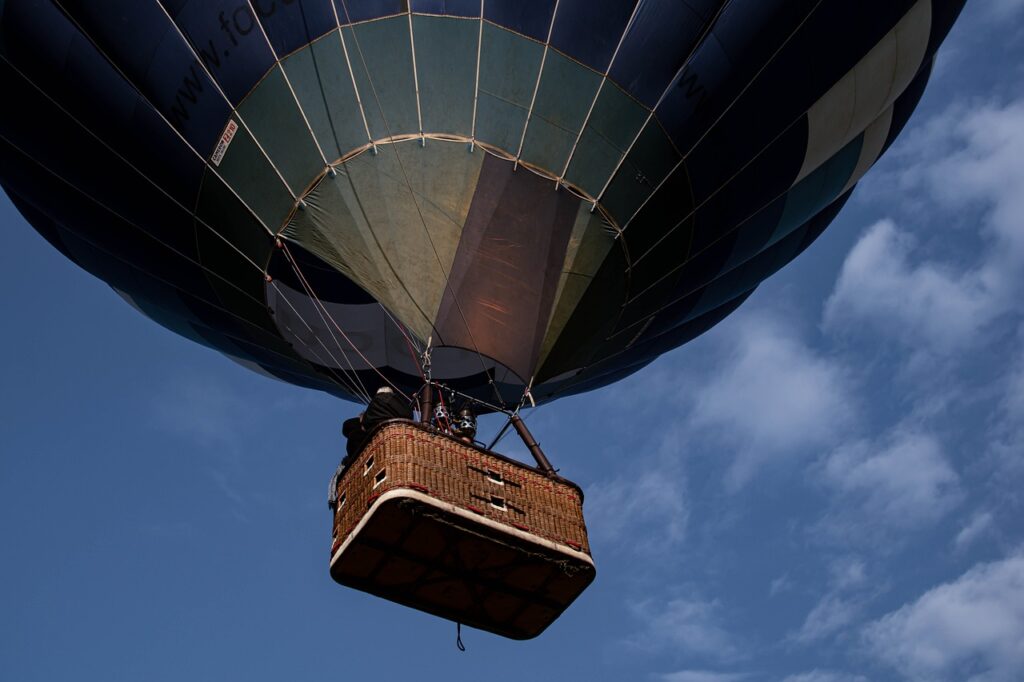 Hot air balloon flying during the great migration safari