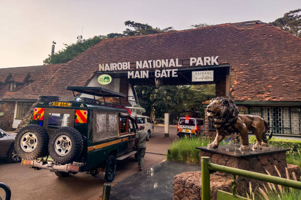 Nairobi National Park Main gate Land Cruisers and safari vans wait to enter the main gate of Nairobi National Park in Africa