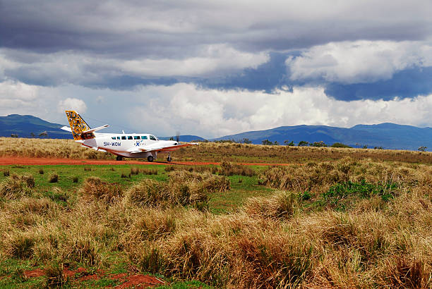 Plane landing on a Masai Mara Airstrip Plane landing on a Masai Mara Airstrip