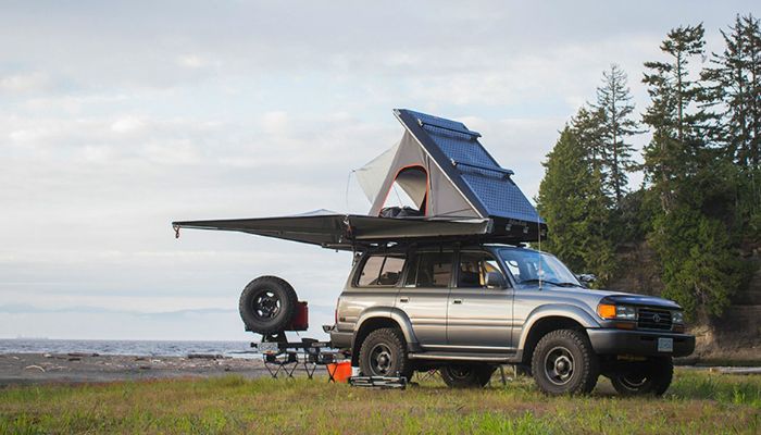 A Land cruiser rental with a single rooftop tent