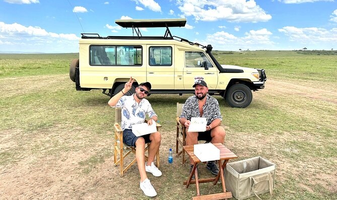 Two tourists outside a 4x4 during their self drive in Masai Mara